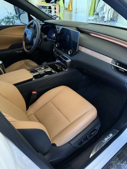 Spotless tan leather interior after a full detail in Kelowna, BC