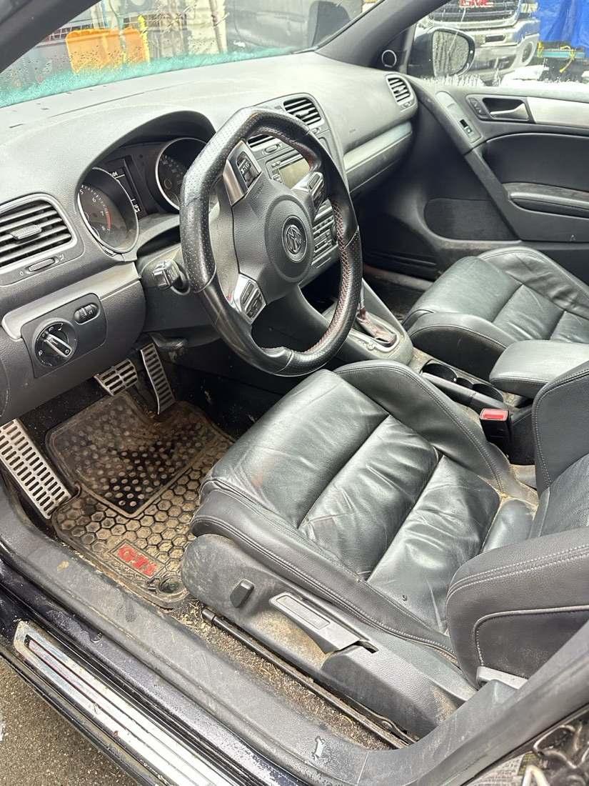 VW Golf interior before detailing — soiled seats and sill