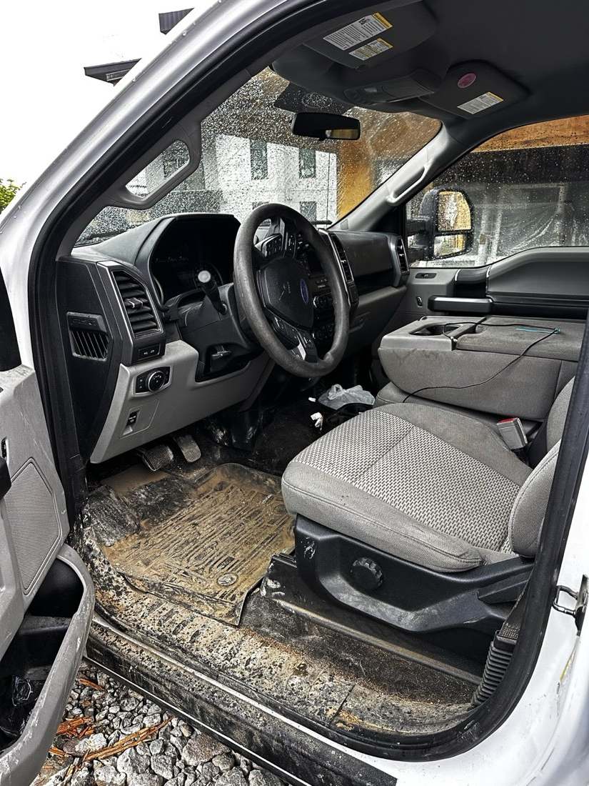 Truck interior before detailing — mud on seat and sill
